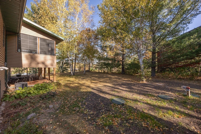 view of yard featuring a sunroom