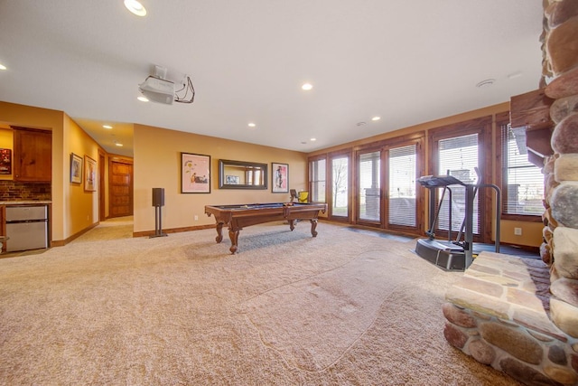 game room with pool table and light colored carpet