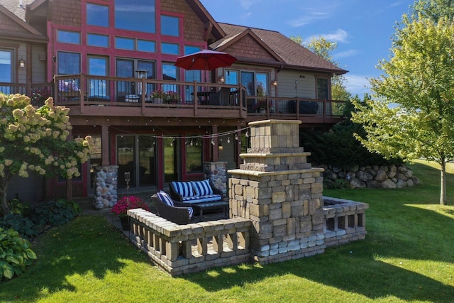 back of house featuring an outdoor living space, a lawn, and a wooden deck