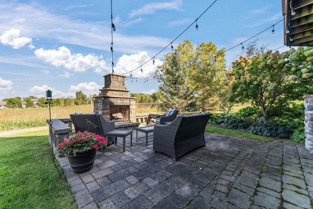 view of patio with an outdoor stone fireplace