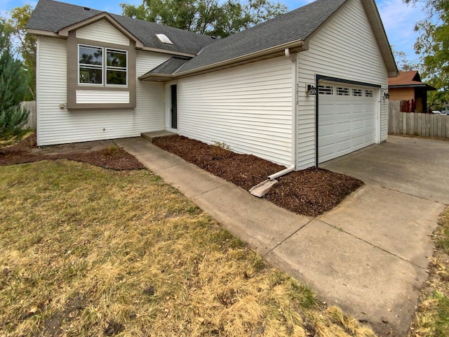 view of front facade with a garage and a front lawn