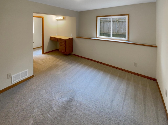 spare room with light carpet