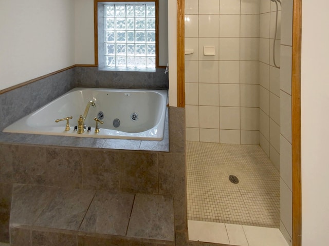 bathroom featuring tile patterned flooring and plus walk in shower