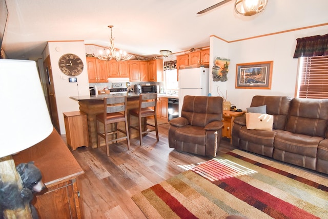 living room with hardwood / wood-style flooring and an inviting chandelier