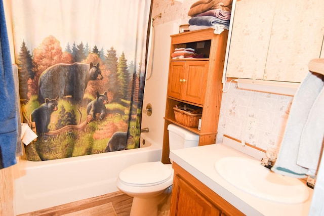 full bathroom featuring vanity, hardwood / wood-style flooring, toilet, and shower / bathtub combination with curtain