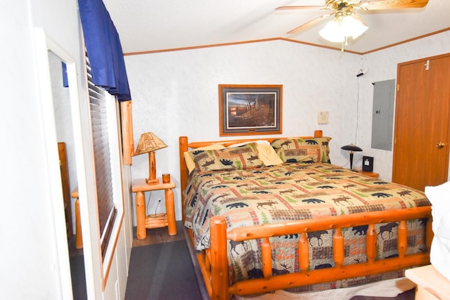 bedroom with ceiling fan, crown molding, electric panel, and vaulted ceiling