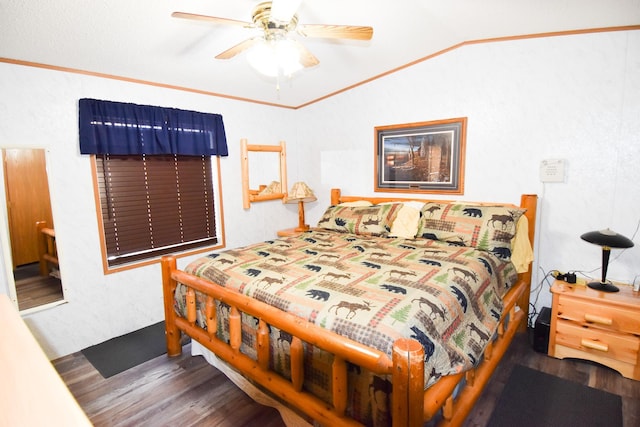 bedroom with ceiling fan, dark hardwood / wood-style flooring, crown molding, and vaulted ceiling