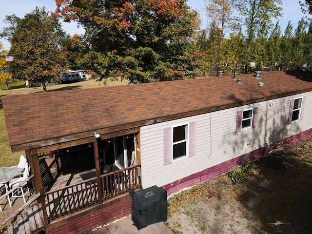 rear view of house with cooling unit