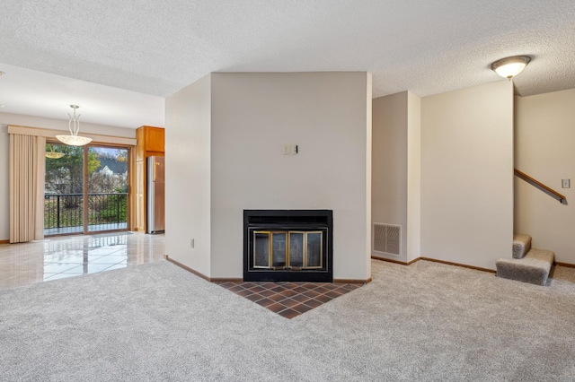 unfurnished living room with a textured ceiling and dark carpet