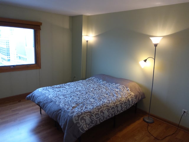 bedroom featuring wood-type flooring