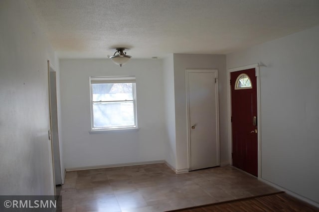 entrance foyer with a textured ceiling