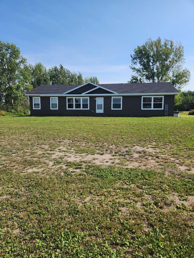 ranch-style house featuring a front lawn