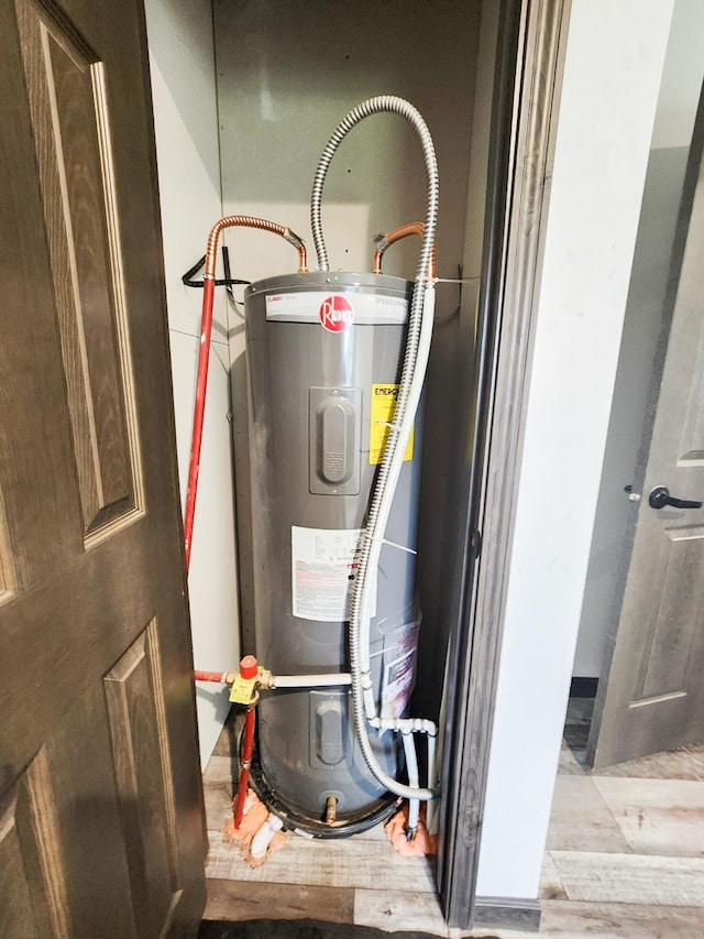 utility room featuring water heater