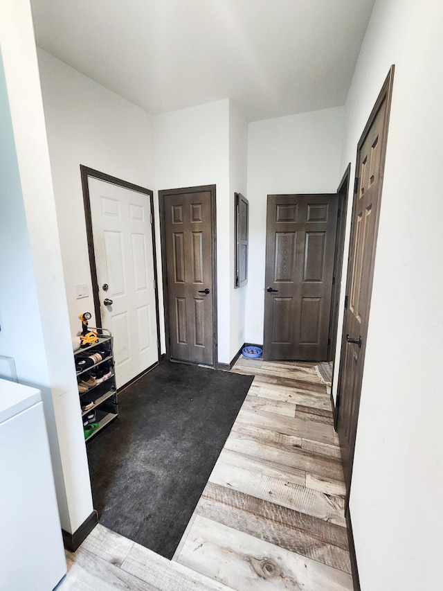 entryway with hardwood / wood-style flooring