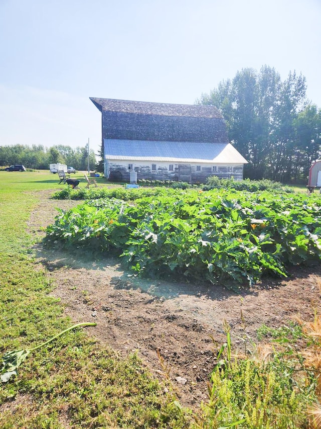 view of side of property with a rural view