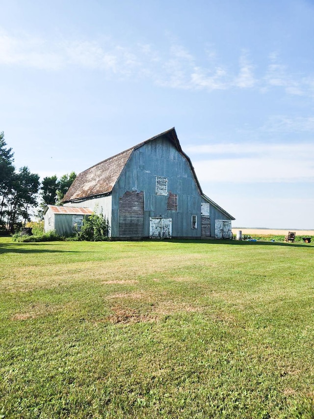 view of outdoor structure with a lawn