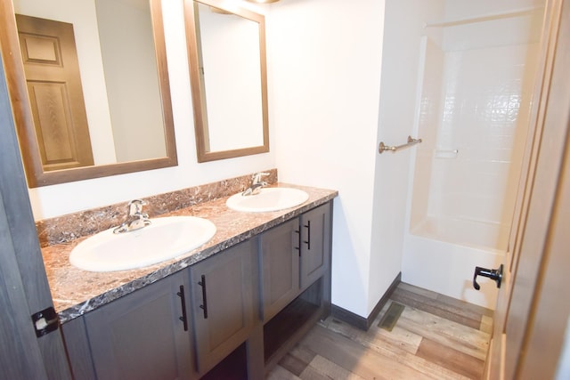 bathroom with vanity and hardwood / wood-style floors