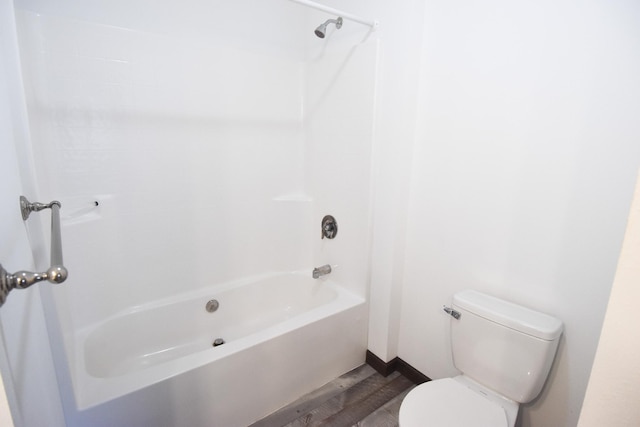 bathroom with shower / tub combination, toilet, and wood-type flooring