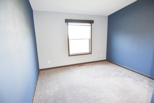 unfurnished room featuring carpet