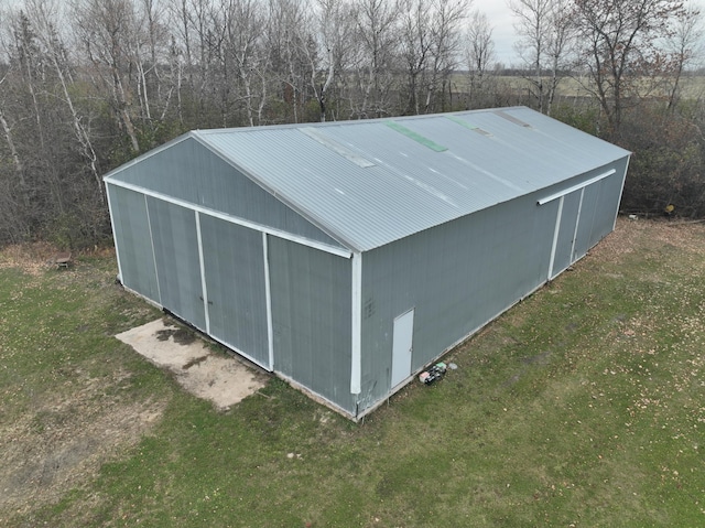 view of outdoor structure with a lawn