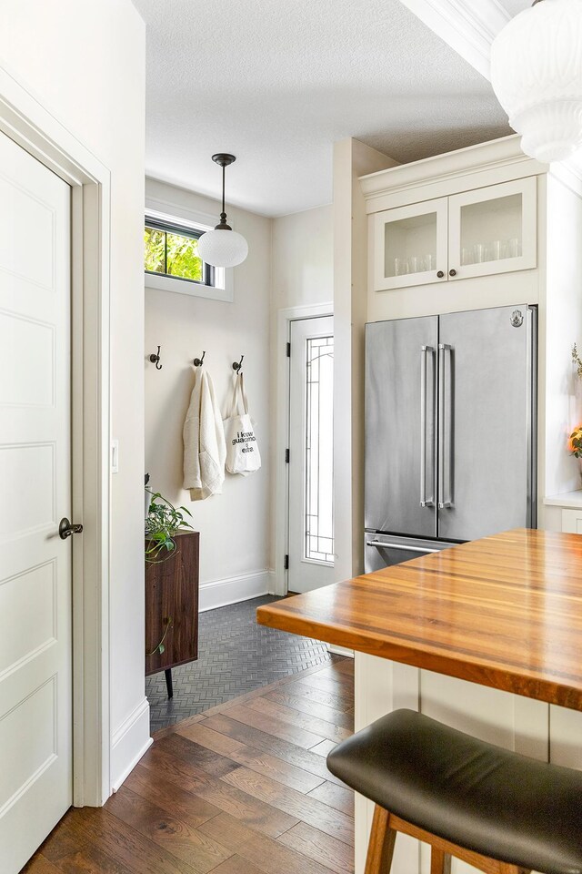 mudroom featuring dark hardwood / wood-style floors and a textured ceiling