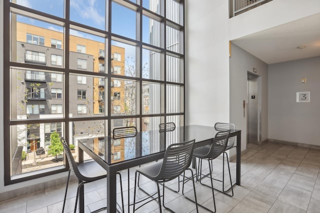 tiled dining space with elevator