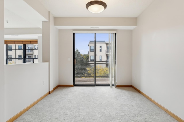 spare room featuring carpet floors