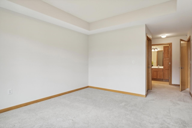 empty room with light colored carpet