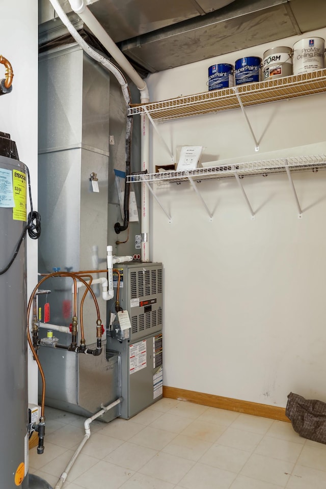 utility room featuring water heater