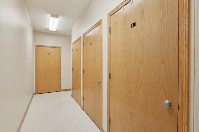 corridor with a textured ceiling