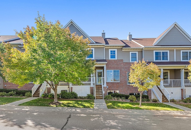 townhome / multi-family property with a porch