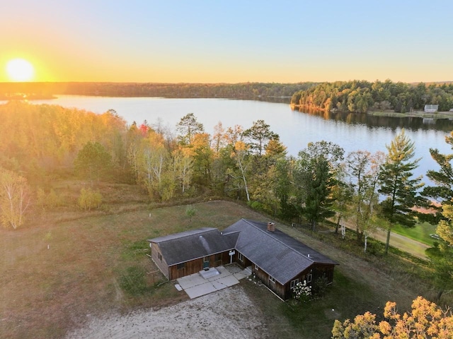 aerial view of property and surrounding area with a large body of water