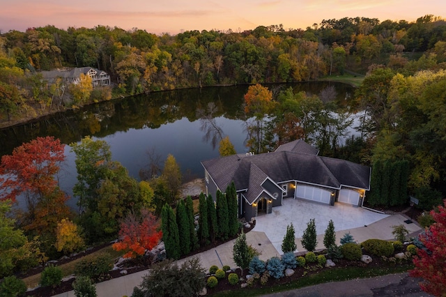 aerial view at dusk with a water view