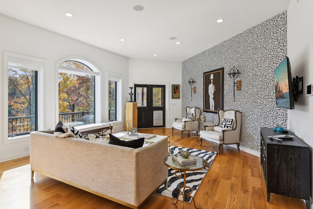 living room with light hardwood / wood-style flooring and french doors