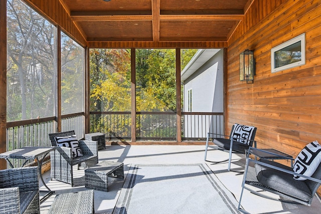 sunroom featuring wood ceiling