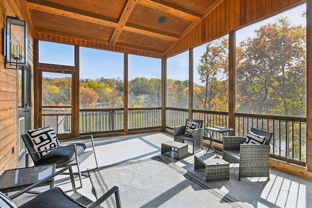 sunroom / solarium with wood ceiling and vaulted ceiling