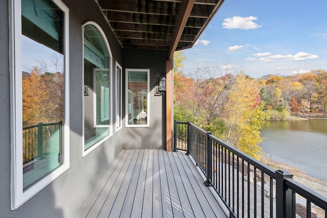 balcony featuring a water view