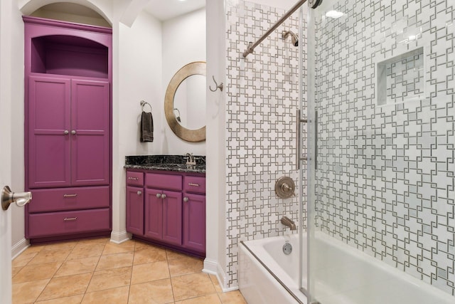 bathroom featuring vanity, tiled shower / bath, and tile patterned floors