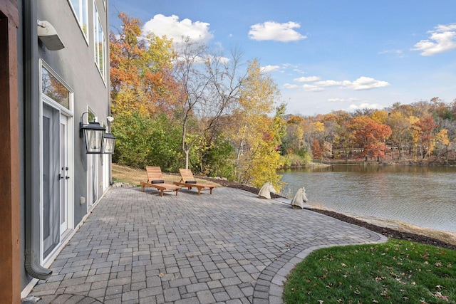 view of patio / terrace with a water view