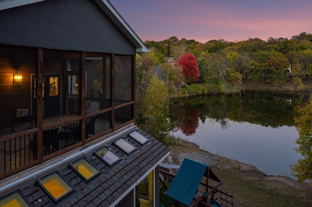 exterior space with a patio area and a water view