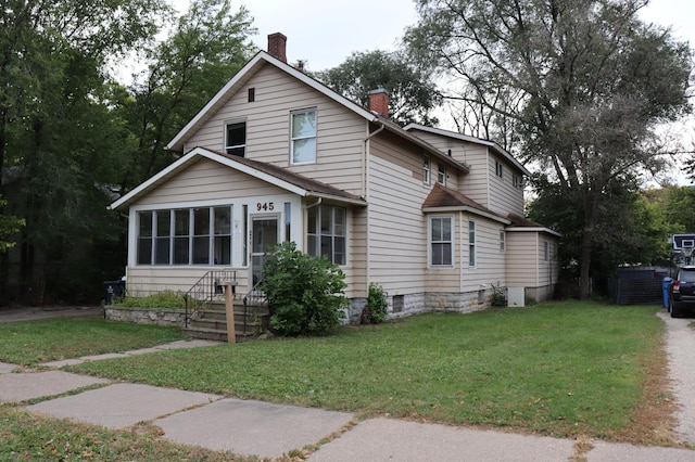 view of front facade featuring a front yard