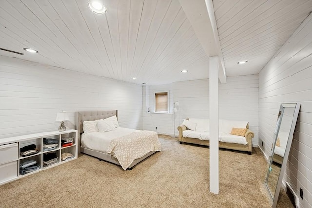 bedroom featuring light carpet, wooden ceiling, wood walls, and recessed lighting