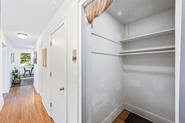 hall with light hardwood / wood-style flooring