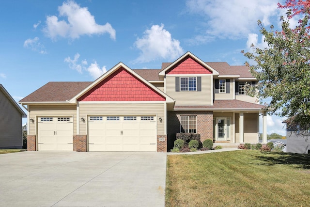 craftsman-style home featuring a front yard, a garage, and a porch