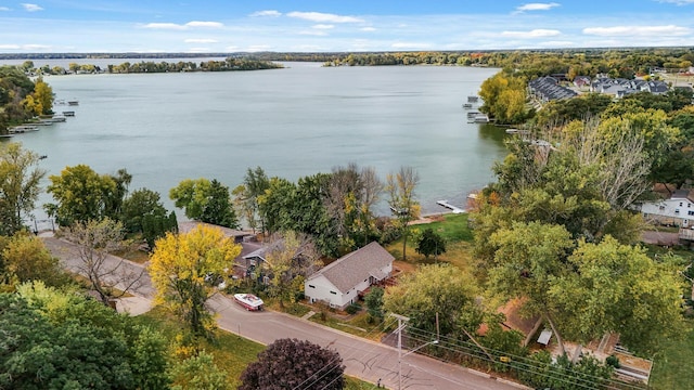 birds eye view of property with a water view