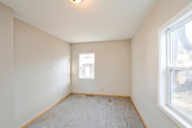 unfurnished room with light colored carpet