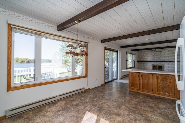 kitchen featuring a baseboard radiator, a water view, white refrigerator, and hanging light fixtures