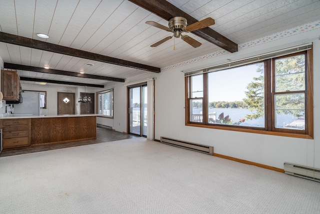 unfurnished living room with light carpet, a baseboard radiator, ceiling fan, and a healthy amount of sunlight