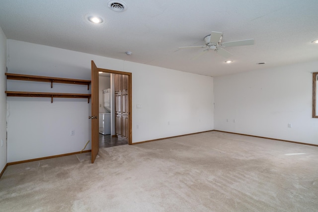 unfurnished bedroom with light carpet, a closet, and ceiling fan