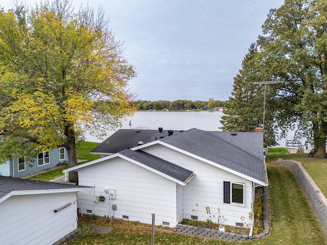 view of side of property with a water view